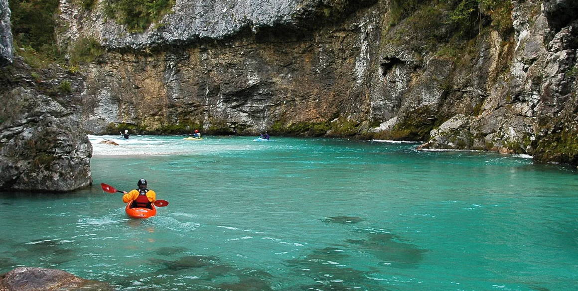Jim Stohlquist paddling on a river